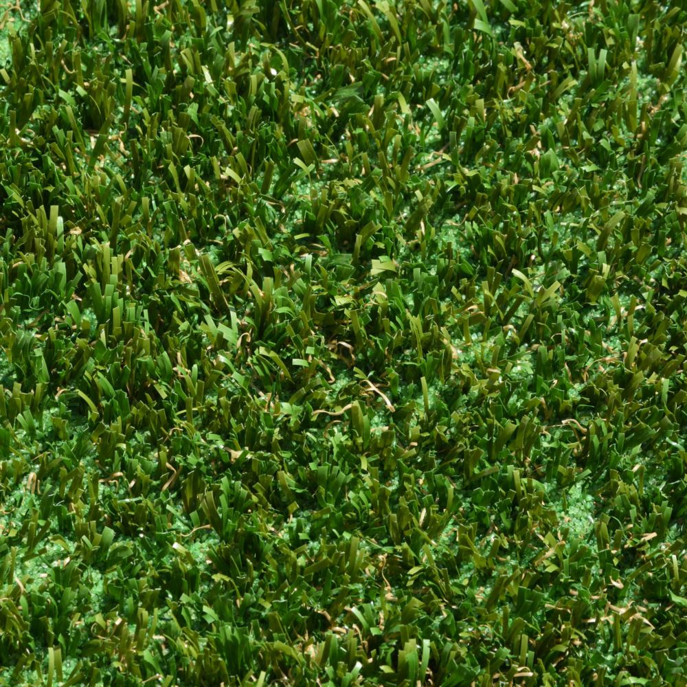 A close up shot of artificial turf designed for playgrounds featuring short green and brown grass strands A close up shot of artificial turf designed for playgrounds featuring short green and brown grass strands
