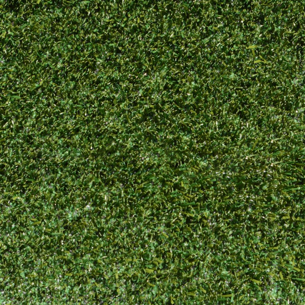Close up shot of artificial pet turf with green and brown strands Close up shot of artificial pet turf with green and brown strands