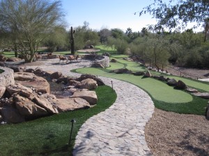 Custom putting greens and pathways with water features from Southwest Greens of the Valley