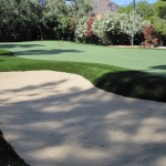 Custom residential putting green with bunker