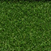 A close up shot of artificial turf designed for playgrounds featuring short green grass strands