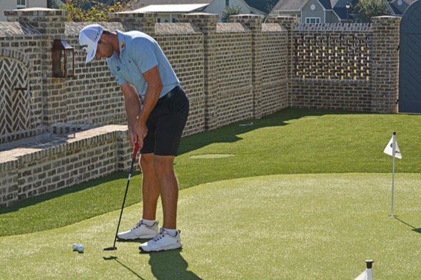 Phoenix Golfer putting on synthetic grass