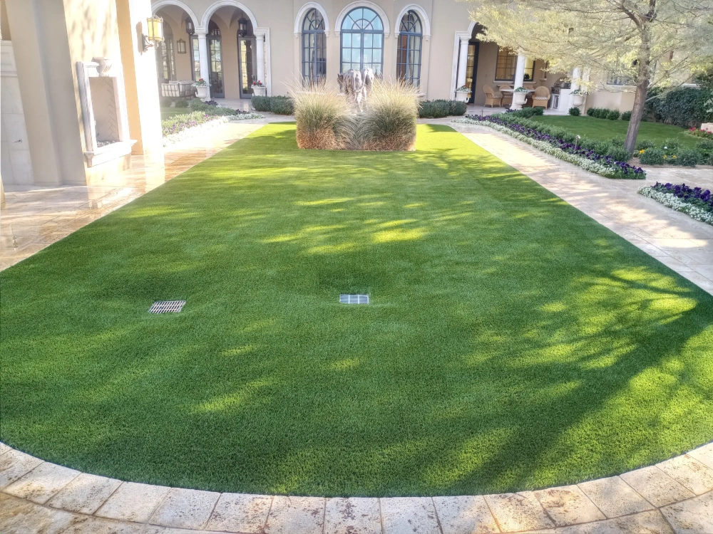 artificial turf in a front yard with a house