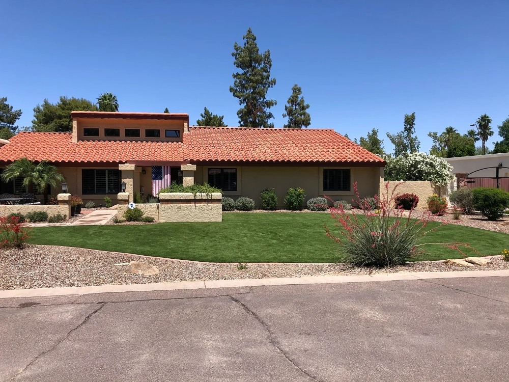 artificial turf in a front yard with a house
