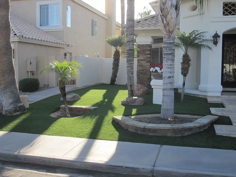 artificial turf in a front yard with a house