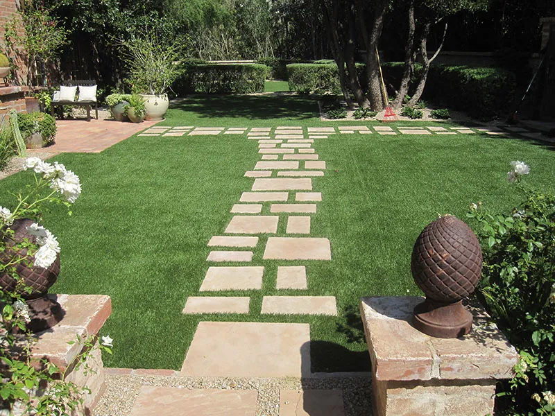 artificial turf in a front yard with pavers