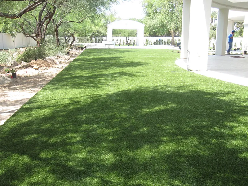 artificial turf in a front yard with a house