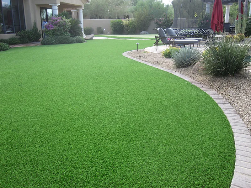artificial turf in a front yard with a house