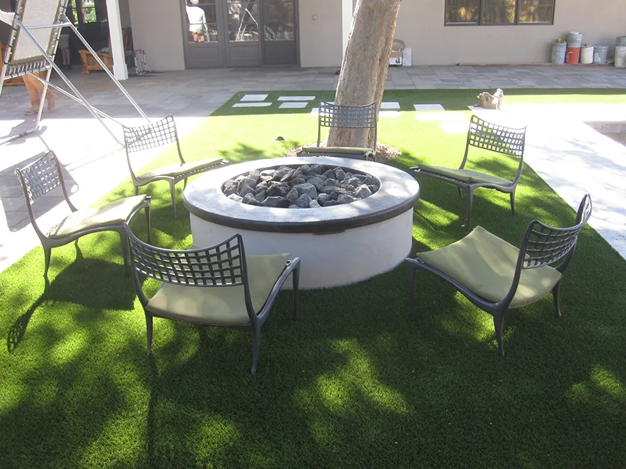 artificial turf in a backyard with a fire pit