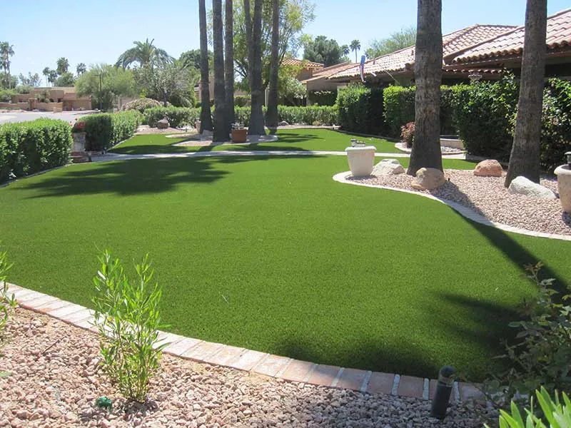 artificial turf in a front yard with a house