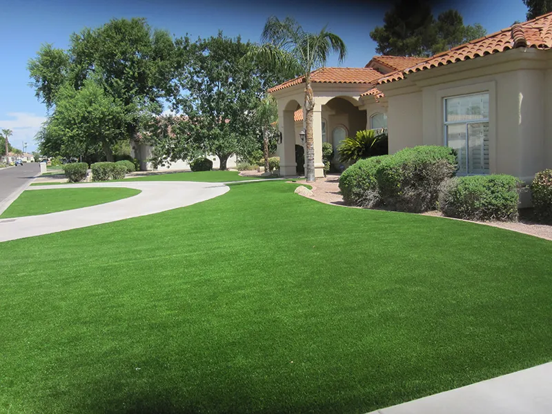 artificial turf in a front yard with a house