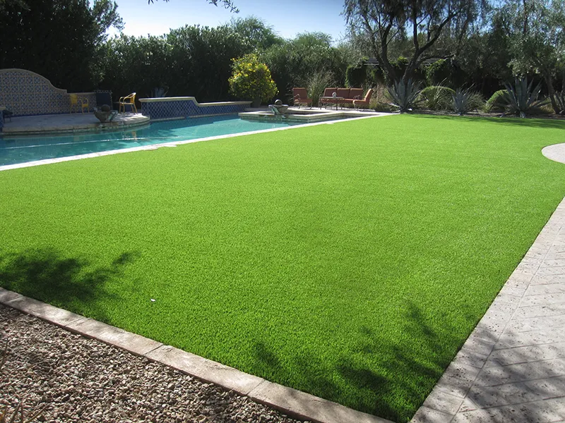 artificial turf in a backyard near a pool