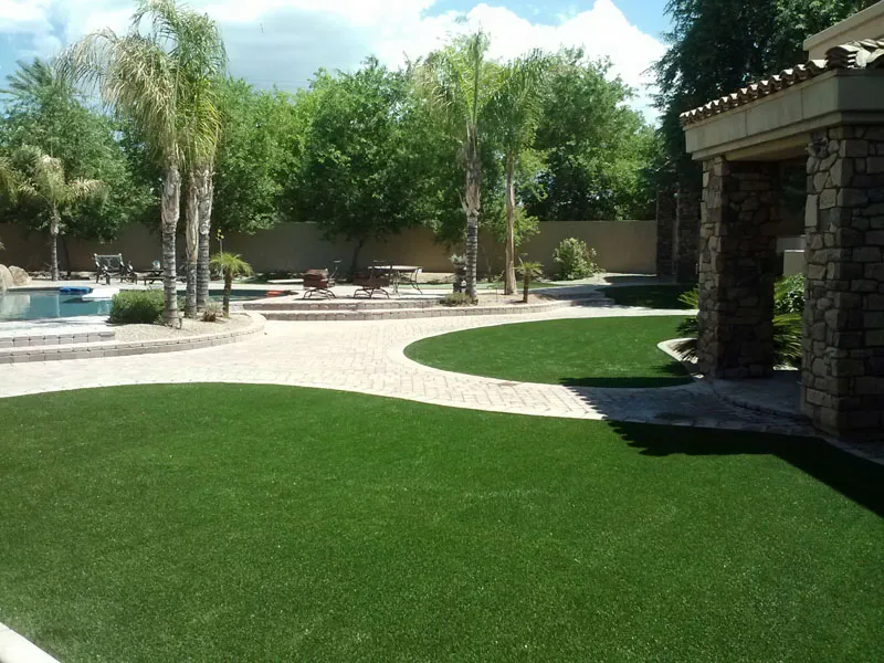 artificial turf in a front yard with a house