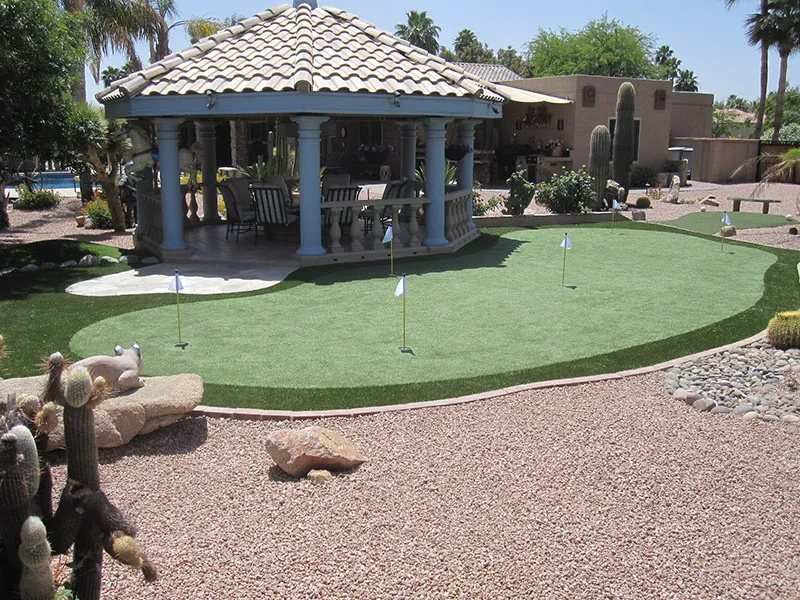 a putting green next to a gazebo