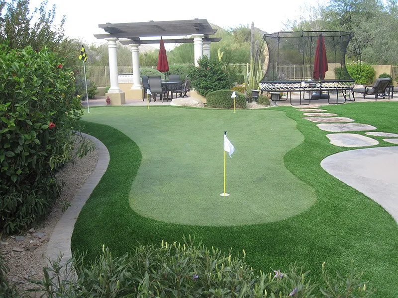 a putting green next to a walkway