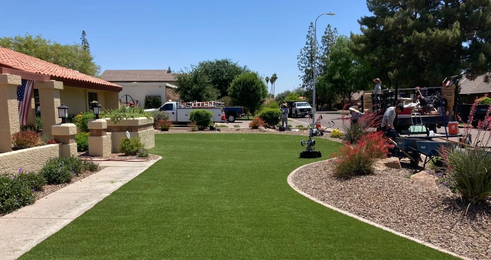 artificial turf in a backyard with the installation crew